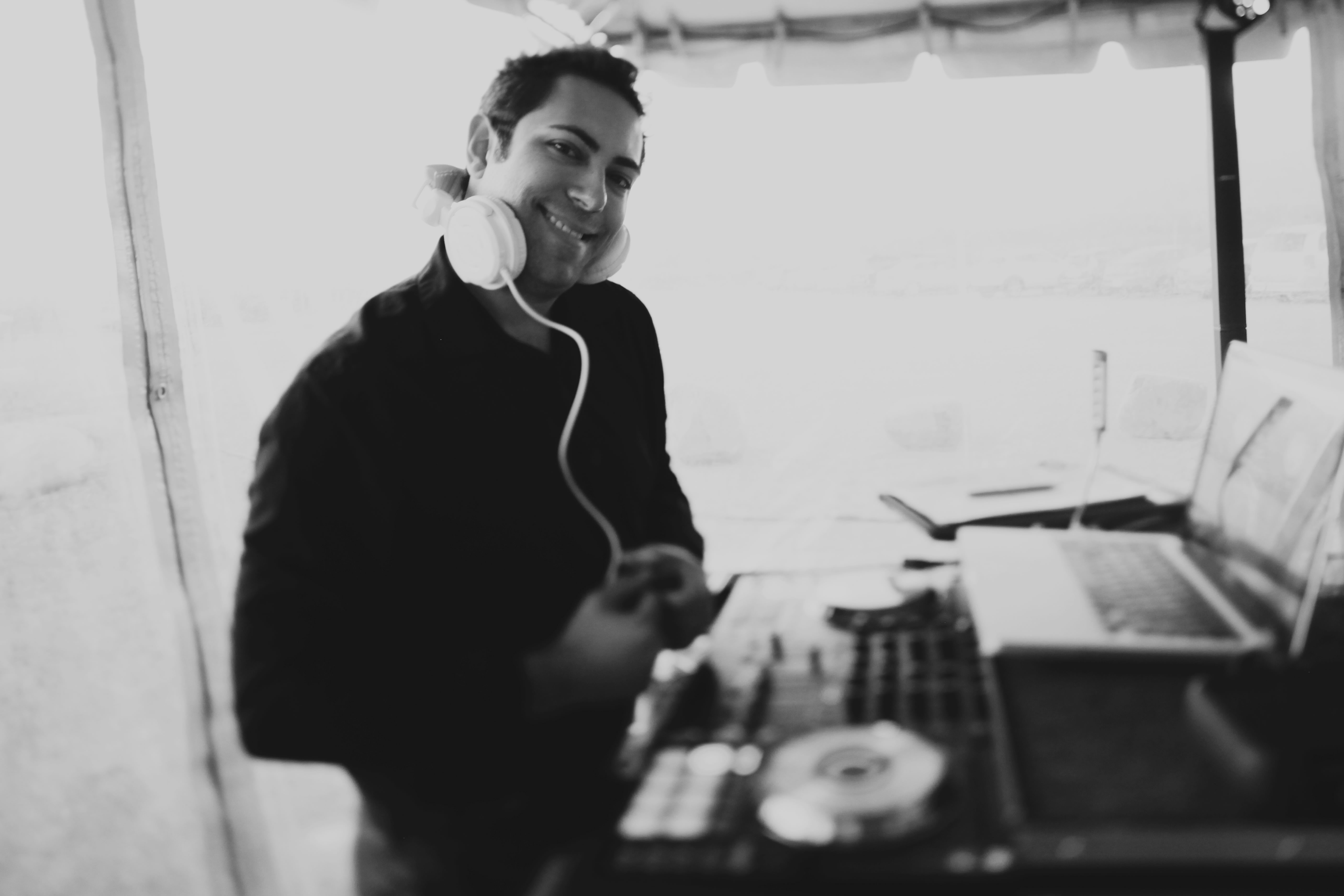 Wedding guests dancing under a tent with DJ JAS