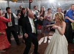 Packed dance floor under a tent at a wedding with DJ JAS