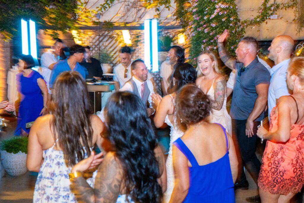 Wedding guests dancing between DJ JAS's LED light columns at Arnoldi's Cafe, Santa Barbara