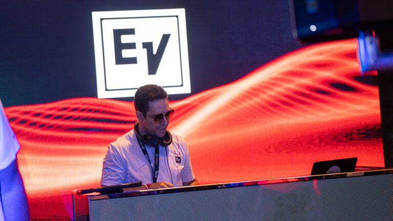 DJ JAS mixing at the Electro-Voice booth at DJX 2024