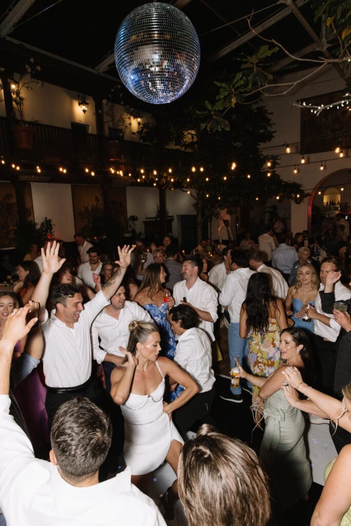 Mirror ball over a full dance floor at El Paseo