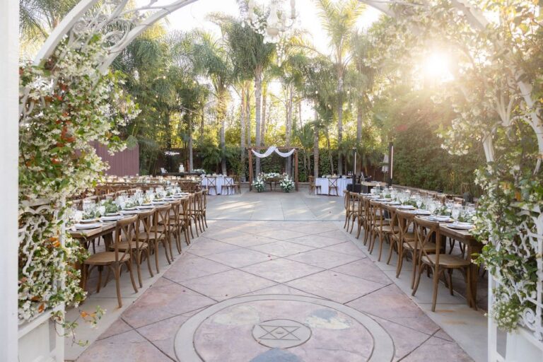Reception tables and dance floor among the palms at Rancho de las Palmas in Moorpark