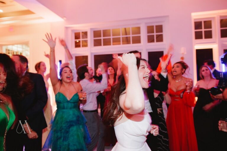 Bride and guests with hands in the air on the dance floor at Sherwood Country Club, Thousand Oaks