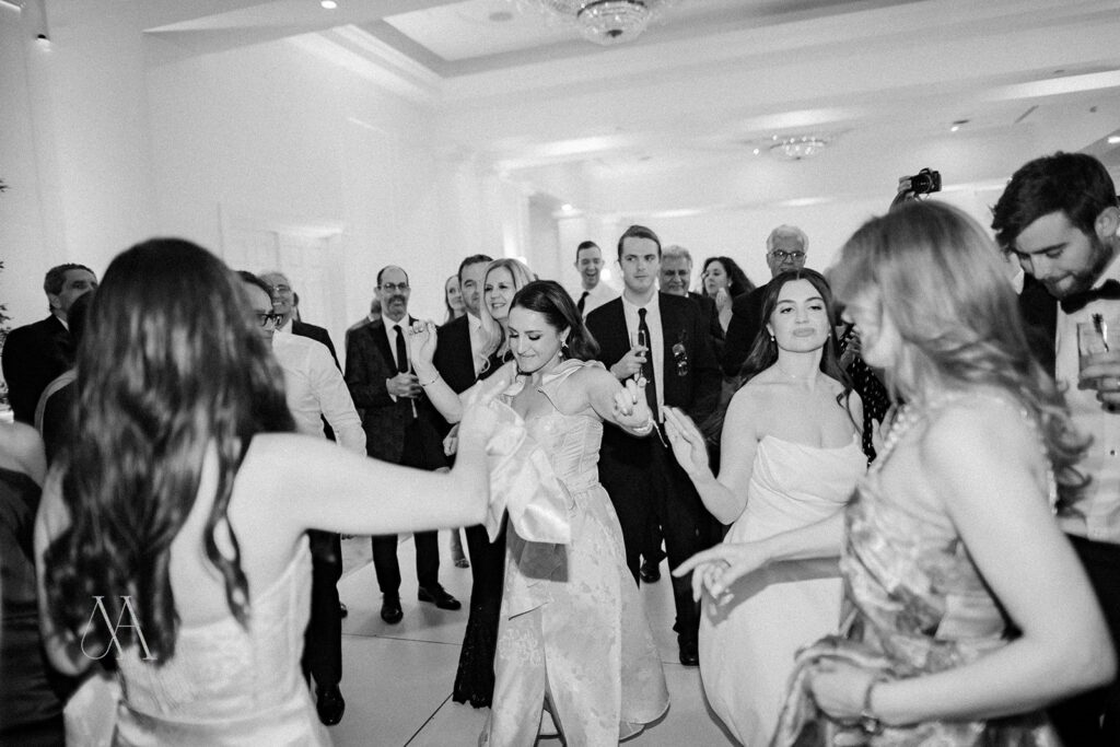Black-and-white photo of a full dance floor at a Sherwood Country Club wedding